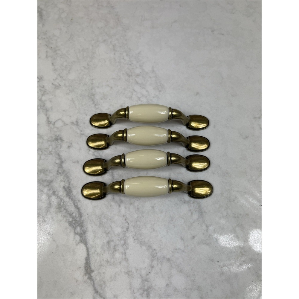 SET of 4 VTG BRASS TONE METAL & BEIGE WHITE DRAWER DOOR PULLS. 3" Centers